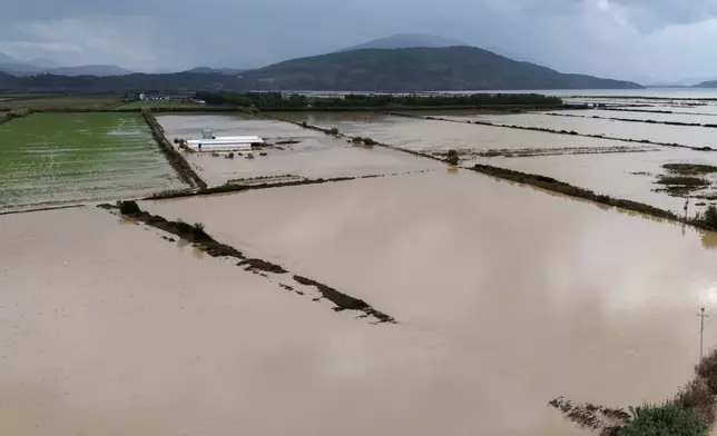 Flooded areas are seen from above after a week of torrential rains in the town of Cuke near Sarande, southern Albania, Saturday, Nov. 22, 2025. (AP Photo/Vlasov Sulaj)
