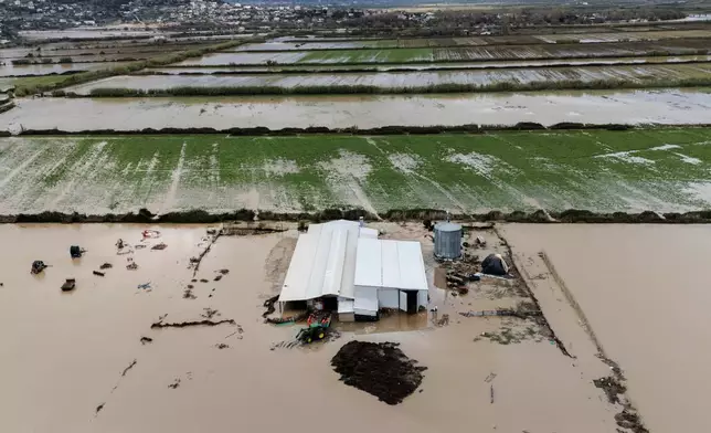 Flooded areas are seen from above after a week of torrential rains in the town of Cuke near Sarande, southern Albania, Saturday, Nov. 22, 2025. (AP Photo/Vlasov Sulaj)