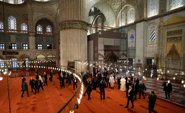 Pope Leo XIV visits the Ottoman-era Sultan Ahmed or Blue Mosque, in Istanbul, Turkey, Saturday, Nov. 29, 2025. (AP Photo/Emrah Gurel)