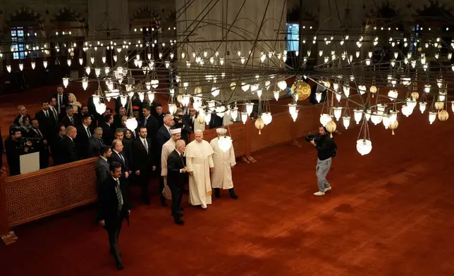 Pope Leo XIV visits the Ottoman-era Sultan Ahmed or Blue Mosque, in Istanbul, Turkey, Saturday, Nov. 29, 2025. (AP Photo/Emrah Gurel)