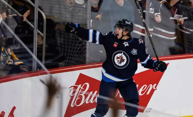 Winnipeg Jets' Brad Lambert (93) celebrates his goal against the Pittsburgh Penguins during the first period of an NHL hockey game, Saturday, Nov. 1, 2025, in Winnipeg, Manitoba. (John Woods/The Canadian Press via AP)
