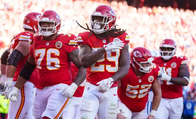 Kansas City Chiefs running back Kareem Hunt (29) celebrates after a touchdown against the Indianapolis Colts during the second half of an NFL football game Sunday, Nov. 23, 2025, in Kansas City, Mo. (AP Photo/Ed Zurga)