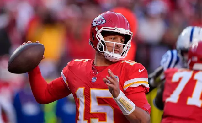 Kansas City Chiefs quarterback Patrick Mahomes (15) throws against the Indianapolis Colts during the second half of an NFL football game Sunday, Nov. 23, 2025, in Kansas City, Mo. (AP Photo/Charlie Riedel)