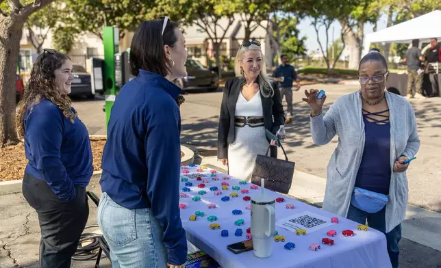 Carmelitos Community members engage with PowerFlex employees at Carmelitos Charge Up! event