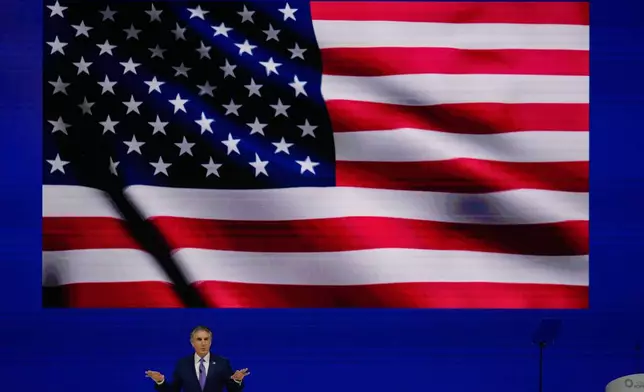 CORRECTS NAME SPELLING - U.S. Interior Secretary Doug Burgum speaks during the inaugural session of annual Abu Dhabi International Petroleum Exhibition and Conference (ADIPEC), in Abu Dhabi, United Arab Emirates, Monday, Nov. 3, 2025. (AP Photo/Altaf Qadri)