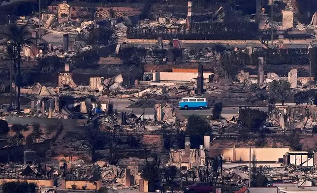 FILE - A VW bus sits among burned out homes, Thursday, Jan. 9, 2025, in Malibu, Calif. (AP Photo/Mark J. Terrill, File)