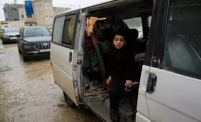 FILE -Palestinians who fled the Israeli military operation in the Nur Shams refugee camp arrive at a temporary shelter for displaced people in the West Bank town of Anabta, near Tulkarem, Feb. 10, 2025. (AP Photo/Nasser Nasser), File)