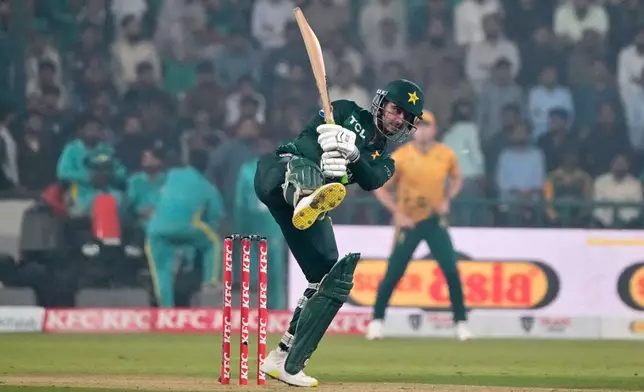 Pakistan's Saim Ayub plays a shot during the second T20 cricket match between Pakistan and South Africa, in Lahore, Pakistan, Friday, Oct. 31, 2025. (AP Photo/K.M. Chaudary)
