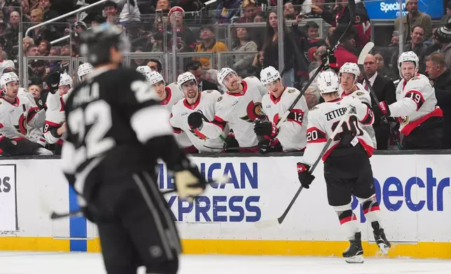 Ottawa Senators left wing Fabian Zetterlund (20) celebrates his goal with teammate during the third period of an NHL hockey game against the Los Angeles Kings Monday, Nov. 24, 2025, in Los Angeles. (AP Photo/Jae C. Hong)