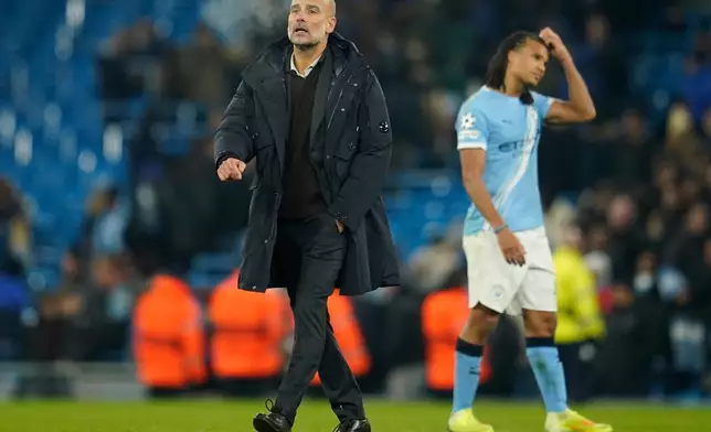 Manchester City's head coach Pep Guardiola walks on the pitch after the end of the Champions League opening phase soccer match between Manchester City and Bayer Leverkusen in Manchester, England, Tuesday, Nov. 25, 2025. (AP Photo/Dave Thompson)