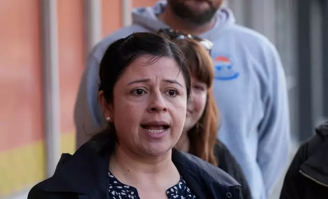 Maria Guzman and other parents of young children speak outside of Rayito de Sol Spanish Immersion Early Learning Center after an employee of the preschool was arrested by federal immigration agents, Wednesday, Nov. 5, 2025, in Chicago. (AP Photo/Erin Hooley)