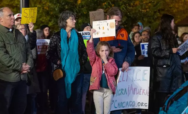 Hundreds of community members, parents, and elected officials attend a rally at Northcenter Town Square, in support of "Ms. Diana" an educator who was detained by federal law enforcement officers at Rayito de Sol Spanish Immersion Early Learning Center this morning, Wednesday, Nov. 5, 2025, in Chicago. (Tyler Pasciak LaRiviere/Chicago Sun-Times via AP)