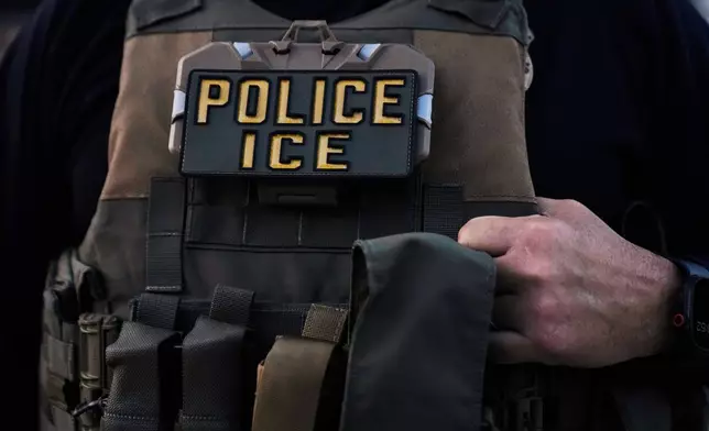 FILE - A U.S. Immigration and Customs Enforcement agent is seen in Park Ridge, Ill., Sept. 19, 2025. (AP Photo/Erin Hooley, File)
