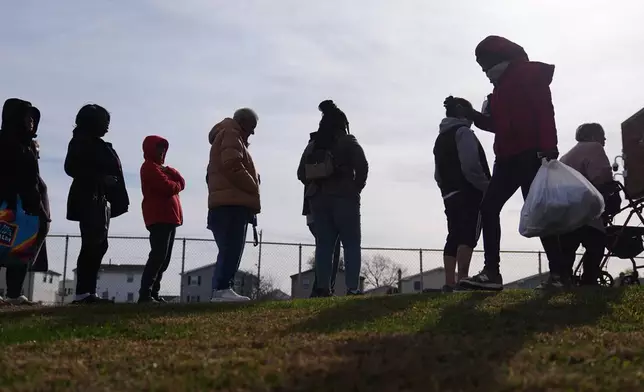 People wait in line durning an emergency food distribution at The Jewish Federation of Greater Philadelphia's Mitzvah Food Program in Philadelphia, Friday, Nov. 7, 2025. (AP Photo/Matt Rourke)