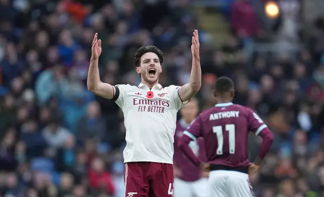 Arsenal's Declan Rice celebrates after scoring his side's second goal during the English Premier League soccer match between Burnley and Arsenal in Burnley, England, Saturday, Nov. 1, 2025. (AP Photo/Jon Super)