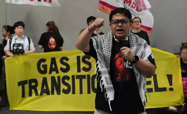 Activists participate in a demonstration against fossil fuels at the COP30 U.N. Climate Summit, Wednesday, Nov. 19, 2025, in Belem, Brazil. (AP Photo/Fernando Llano)