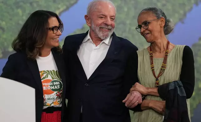 Brazil President Luiz Inacio Lula da Silva, center, attends a news conference with his wife Rosangela da Silva, left, and Marina Silva, Brazil environment minister, at the COP30 U.N. Climate Summit, Wednesday, Nov. 19, 2025, in Belem, Brazil. (AP Photo/Andre Penner)