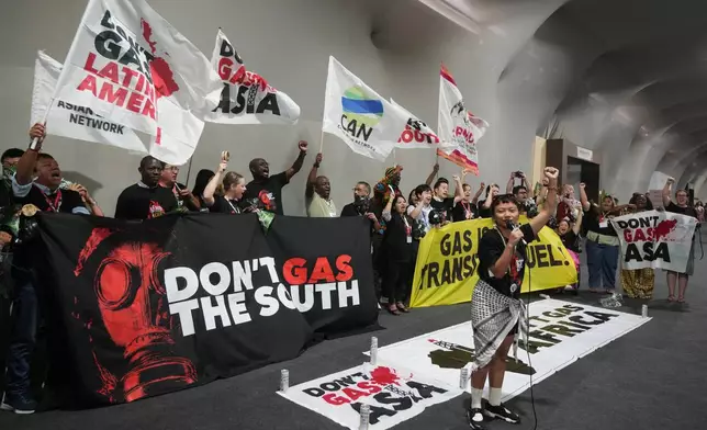 Activists participate in a demonstration against fossil fuels at the COP30 U.N. Climate Summit, Wednesday, Nov. 19, 2025, in Belem, Brazil. (AP Photo/Andre Penner)