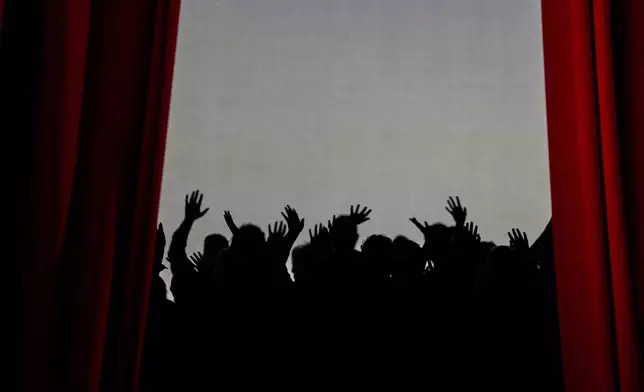 Performers wave to the audience as as the final curtain closes at the International Opera Awards, held at the Greek National Opera, in Athens, Thursday, Nov. 13, 2025. (AP Photo/Petros Giannakouris)