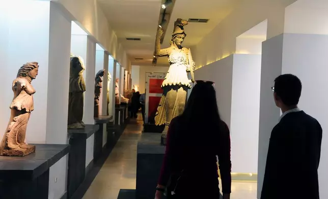 FILE - In this photo released by the Syrian official news agency, SANA, people attend the reopening ceremony for Syria's National Museum, in Damascus, Syria, Oct. 28, 2018. (SANA via AP, File)