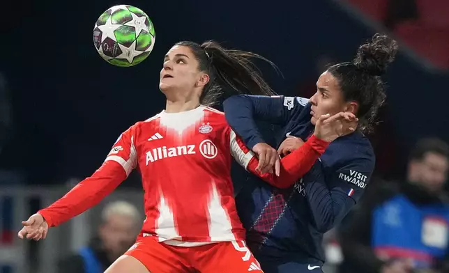 Bayern's Jovana Damnjanovic, left, and PSG's Isabela Chagas fight for the ball during a women¥s Champions League soccer match between Paris Saint-Germain and Bayern in Paris, Thursday, Nov. 20, 2025.((AP Photo/Michel Euler)