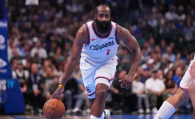 Los Angeles Clippers guard James Harden dribbles up court against the Dallas Mavericks during the second half of an NBA Cup basketball game Friday, Nov. 14, 2025, in Dallas. (AP Photo/Julio Cortez)