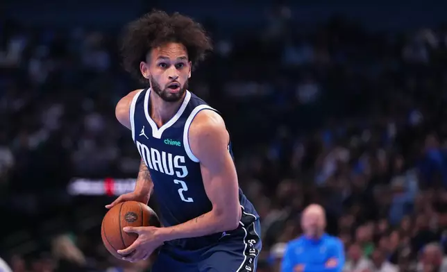 Dallas Mavericks center Dereck Lively II works the floor against the Los Angeles Clippers during the first half of an NBA Cup basketball game Friday, Nov. 14, 2025, in Dallas. (AP Photo/Julio Cortez)