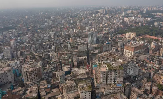 A general aerial view of an old city where roofs and walls collapsed after an earthquake in Dhaka, Bangladesh, Friday, Nov. 21, 2025. (AP Photo/Abdul Goni)