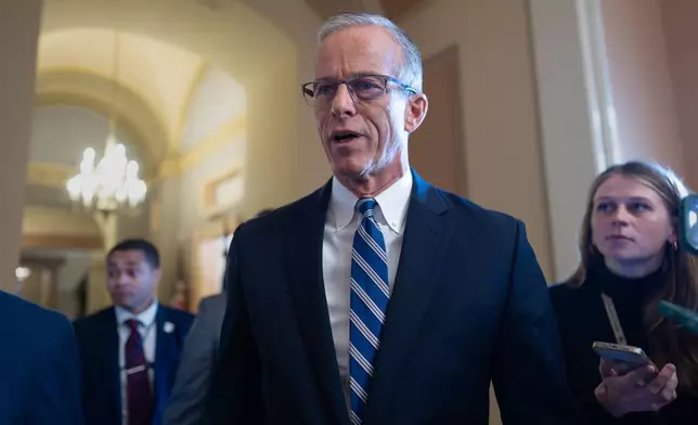 Speaking to reporters, Senate Majority Leader John Thune, R-S.D., responds to Senate Democratic Leader Chuck Schumer to reopen the government if Republicans extend expiring health care subsidies for one year, at the Capitol in Washington, Friday, Nov. 7, 2025, day 38 of the government shutdown. (AP Photo/J. Scott Applewhite)