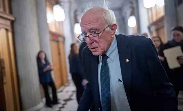 Sen. Bernie Sanders, I-Vt., heads to the chamber as the Senate votes to bring the longest government shutdown in U.S. history to an end after a bipartisan compromise, at the Capitol in Washington, Monday, Nov. 10, 2025. (AP Photo/J. Scott Applewhite)