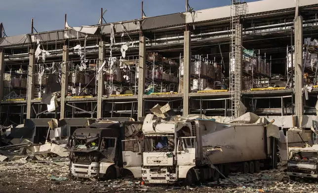 A Novus logistics center is seen damaged after a Russian strike on Kyiv, Ukraine, on Tuesday, Nov. 25, 2025. (AP Photo/Evgeniy Maloletka)