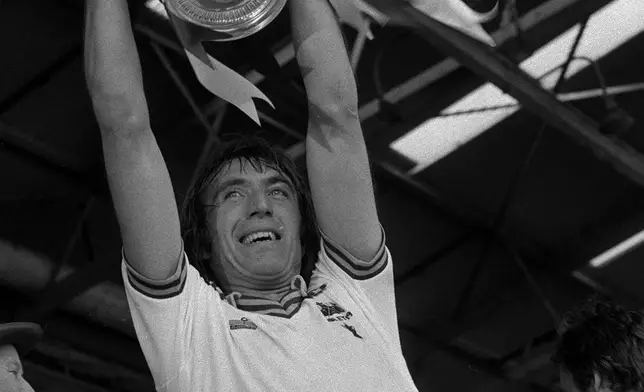 FILE - West Ham United captain Billy Bonds holds aloft the FA Cup at Wembley, London, May 10, 1980. Billy Bonds, the former West Ham United player and manager, has died, Sunday Nov. 30, 2025. He was 79. (PA via AP, File)
