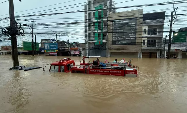 A fire truck is submerged in floodwaters in Songkhla province, southern Thailand, Monday, Nov. 24, 2025. (AP Photo)
