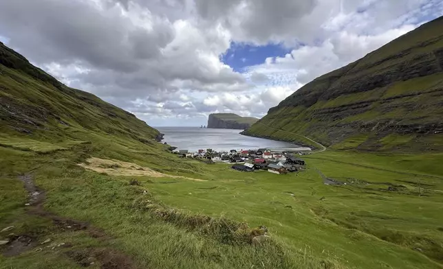 FILE - The view from a hiking trail of the village of Tjornuvik, Faroe Islands, Sept. 9, 2025. (AP Photo/Cara Anna, File)