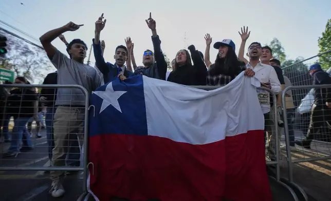 Supporters of presidential candidate Jose Antonio Kast of the Republican Party react after the polls closed in general elections in Santiago, Chile, Sunday, Nov. 16, 2025. (AP Photo/Esteban Felix)