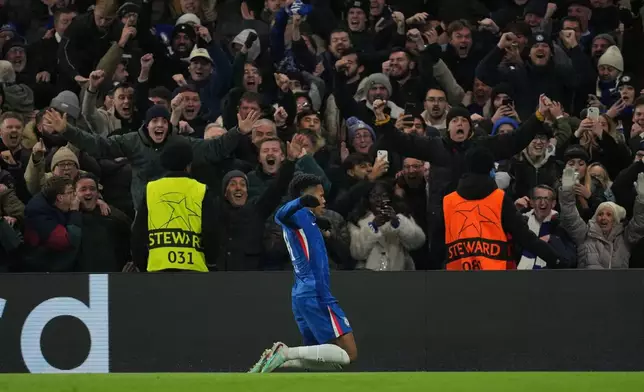 Chelsea's Estevao celebrates after scoring his side's second goal during the Champions League opening phase soccer match between Chelsea and Barcelona in London, Tuesday, Nov. 25, 2025. (AP Photo/Kin Cheung)