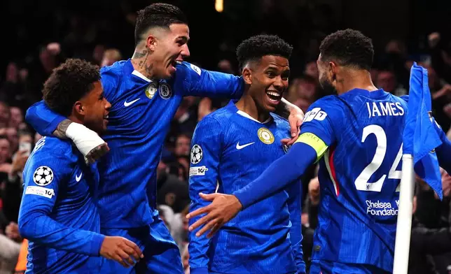 Chelsea's Estevao, second right, celebrates with his teammates after scoring his side's second goal during the Champions League opening phase soccer match between Chelsea and Barcelona in London, England, Tuesday, Nov. 25, 2025. (Bradley Collyer/PA via AP)