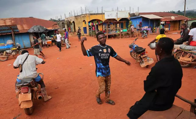 Residents of the Jema community in the Western North Region, Ghana, Friday, Sept. 12, 2025. (AP Photo/Tsraha Yaw)
