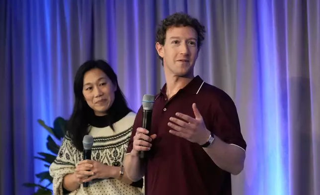 Meta CEO Mark Zuckerberg, right, speaks next to his wife, Priscilla Chan, co-founder and co-CEO of the Chan Zuckerberg Initiative (CZI), during an event at the Biohub Imaging Institute in Redwood City, Calif., Wednesday, Nov. 5, 2025. (AP Photo/Jeff Chiu)