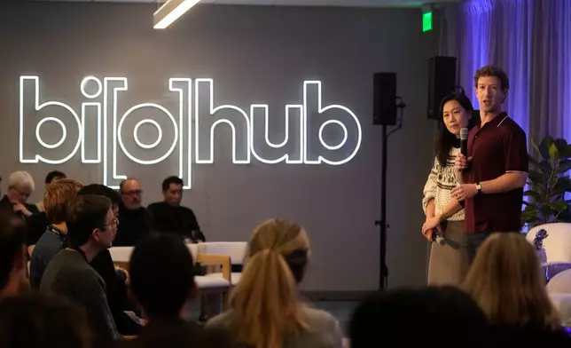 Meta CEO Mark Zuckerberg, right, speaks next to his wife, Priscilla Chan, co-founder and co-CEO of the Chan Zuckerberg Initiative (CZI), during an event at the Biohub Imaging Institute in Redwood City, Calif., Wednesday, Nov. 5, 2025. (AP Photo/Jeff Chiu)