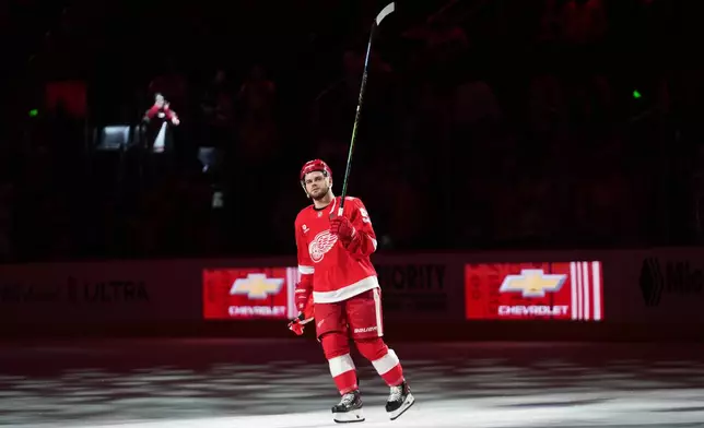 Detroit Red Wings right wing Alex Debrincat (93) celebrates after an NHL hockey game against the Anaheim Ducks Thursday, Nov. 13, 2025, in Detroit. (AP Photo/Paul Sancya)