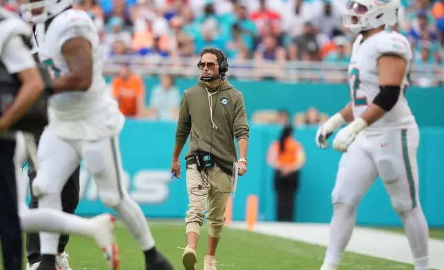 Miami Dolphins head coach Mike McDaniel watches during the first half of an NFL football game against the Buffalo Bills, Sunday, Nov. 9, 2025, in Miami Gardens, Fla. (AP Photo/Rebecca Blackwell)