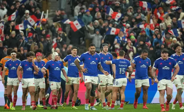 France players react after scoring a try during the rugby union Nations Series match between France and Australia in Saint-Denis, outside Paris, Saturday, Nov. 22, 2025. (AP Photo/Christophe Ena)