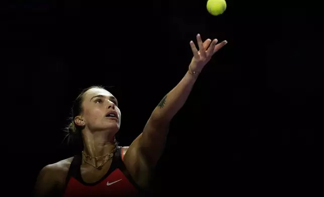 Aryna Sabalenka of Belarus serves against Coco Gauff of the United States during their women's singles match at the WTA tennis finals in Riyadh, Saudi Arabia, Thursday, Nov. 6, 2025. (AP Photo/Fatima Shbair)