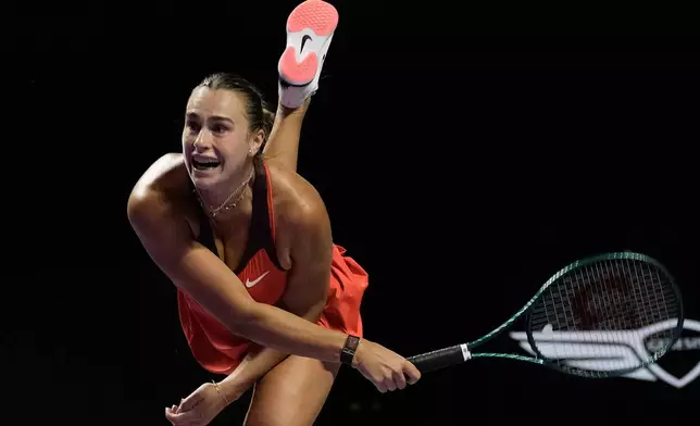 Aryna Sabalenka of Belarus plays a shot against Jessica Pegula of the United States during their women's singles match of the WTA finals in Riyadh, Saudi Arabia, Tuesday, Nov. 4, 2025. (AP Photo/ Fatima Shbair)
