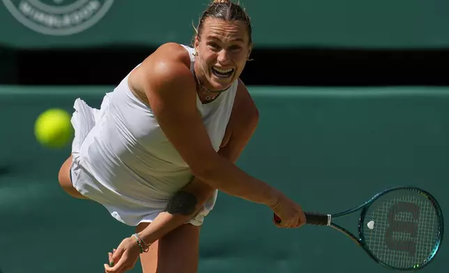 FILE - Aryna Sabalenka of Belarus serves to Amanda Anisimova of the U.S. during a women's singles semifinal match at the Wimbledon Tennis Championships in London, Thursday, July 10, 2025. (AP Photo/Kin Cheung, file)