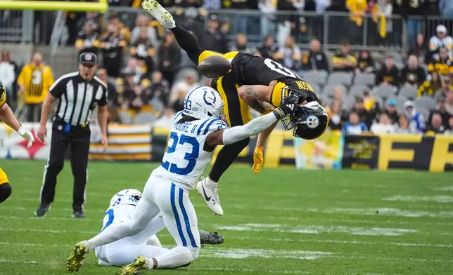 Pittsburgh Steelers wide receiver Roman Wilson (10) fumbles as he's hit by Indianapolis Colts cornerback Kenny Moore II (23) during the second half of an NFL football game in Pittsburgh, Sunday, Nov. 2, 2025. (AP Photo/Gene J. Puskar)