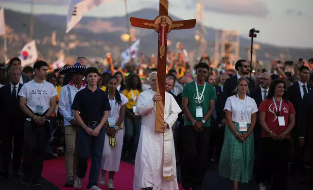 FILE - Pope Leo XIV holds prayer vigil with young people participating in the Youths Jubilee at the Tor Vergata field in Rome, Aug. 2, 2025. (AP Photo/Andrew Medichini, File)