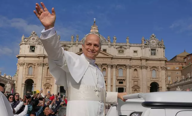FILE - Pope Leo XIV on his popemobile tours St. Peter's Square at the Vatican prior to the inaugural Mass of his pontificate, May 18, 2025. (AP Photo/Andrew Medichini, File)