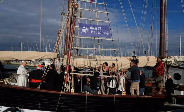 FILE - Pope Leo XIV, left, arrives at the Marina of Ostia, near Rome, for a visit to the "Med 25 - Bel Espoir" Peace Training Ship, Oct. 17, 2025. (AP Photo/Gregorio Borgia, File)